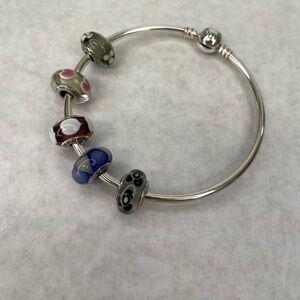 Authentic Pandora 925 sterling silver charm bracelet & 5 Pandora glass beads.